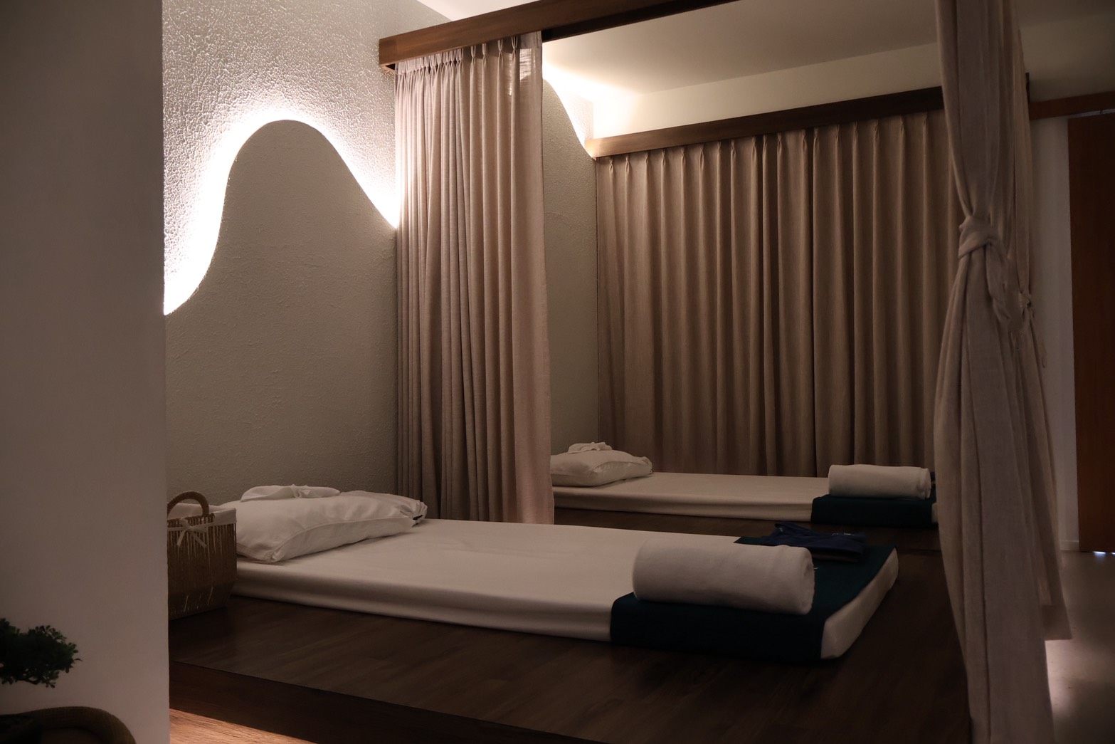 KHET Massage — traditional Thai massage mats with warm ambient lighting
